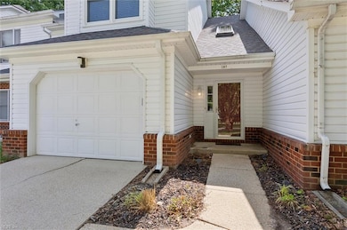 Covered front entry,  attached one car garage and 