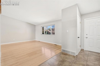Front entry and living room with vaulted ceilings