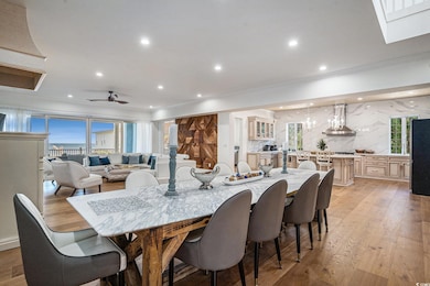 Dining room with crown molding, light wood-style flooring, recessed lighting, and ceiling fan