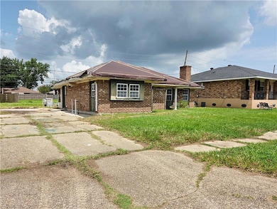 Exterior from the street with oversized driveway
