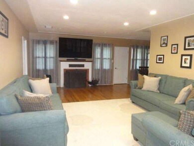 SPACIOUS AND OPEN LIVING ROOM  WITH COZY FIREPLACE