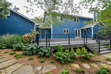 Rear of home with new huge all-weather deck and ou