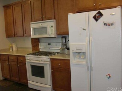 Microwave, gas stove, and walk in pantry
