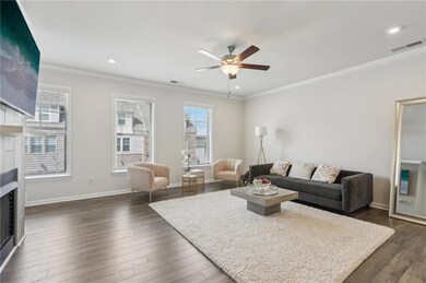 Living room with crown molding, a fireplace, visib