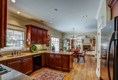 Appliances include 4-burner gas cooktop with downd