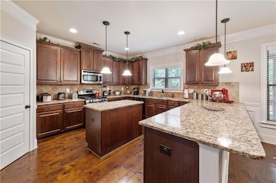 Kitchen with appliances with stainless steel finis