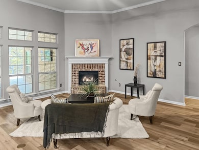 Living room featuring a fireplace, hardwood / wood