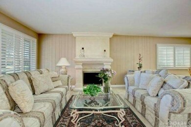 Another view of formal living room, fireplace, pla