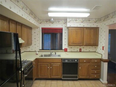 Nice kitchen with pass through to sunroom.