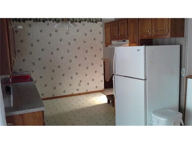 Kitchen has refrigerator & dish machine that stay.