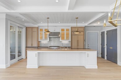 Chef's kitchen conveniently located near sliding d