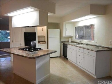 Gas Stove Top in Island, Double Ovens, Refrigerato