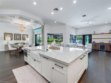Kitchen with dark wood-style floors, open floor pl