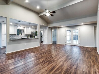 Huge light-filled living space, open to kitchen with French doors to the big backyard!