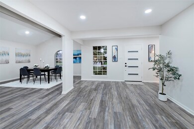 This photo showcases a modern, open-concept entryw