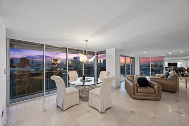 Dining space featuring floor to ceiling windows and tile patterned flooring