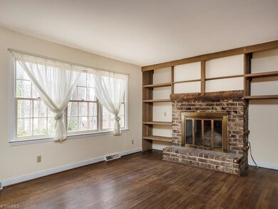 The den has tons of natural light along with built in shelves and a fireplace which has a gas log hookup.