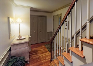 Gracious foyer with hard wood flooring.
