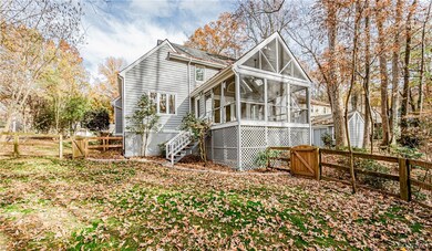 View of side of property featuring a sunroom