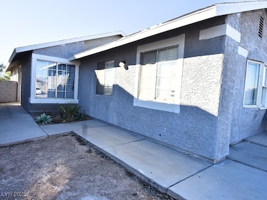 View of side of home with stucco siding