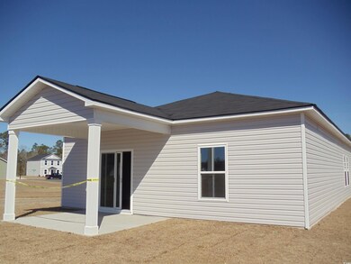 Rear view of house with a patio area