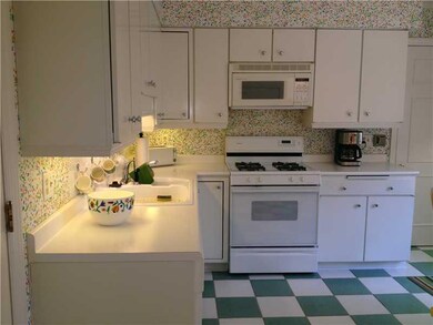 Kitchen. one side of kitchen, gas cooktop, doors t