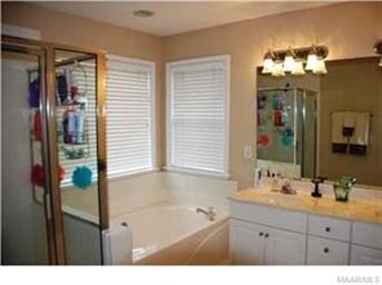 Master bath features double sinks, separate shower