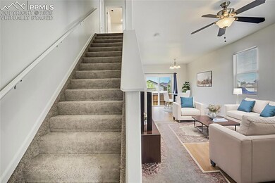 Virtually staged living room and dining area from entry