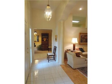 Impressive front entry has 11 feet ceilings and ti