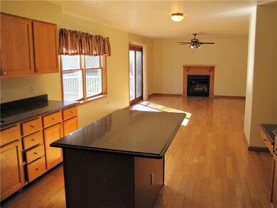 Large center island kitchen open to family room.