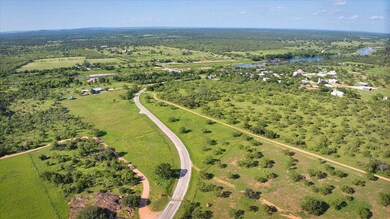 Aerial view of property and surrounding area with