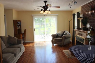 The Living Room  14x17 / Fireplace and hardwood flooring. You will feel right at home.