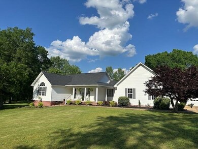 Ranch-style house featuring covered porch and a fr
