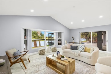 Living room featuring marble look tiles, vaulted c