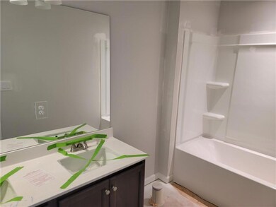Full bath with vanity, baseboards, and shower / bathtub combination