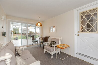 Breezeway with access to back deck &   kitchen