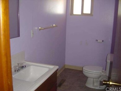 Hall bath with tub and glass shower doors