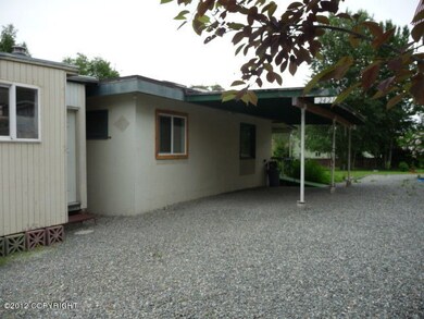 gravel driveway and carport