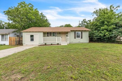 Single story home with covered porch and concrete driveway