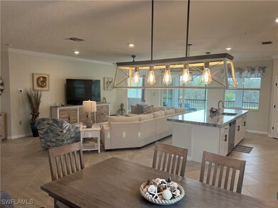 Dining area with a notable chandelier, sink, ornam