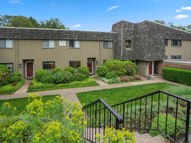 Beautiful landscaping surrounds the entry and the garage is right around the corner.