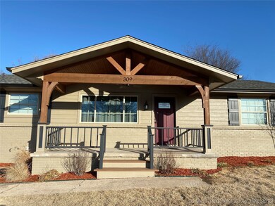 Large covered custom porch with Box Car Siding & R