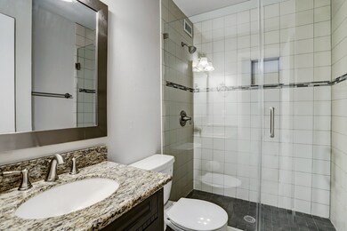 Master bath with granite counter, designer tile, n