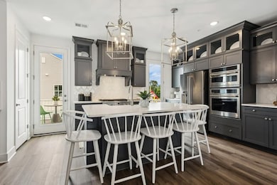 Kitchen with glass upper cabinets