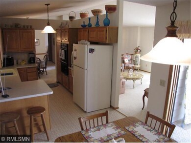 A view of the kitchen, breakfast bar, and eat-in a
