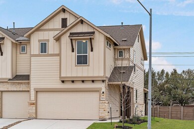 View of property featuring stone siding, board an