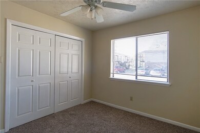 Unfurnished bedroom with a closet, baseboards, cei