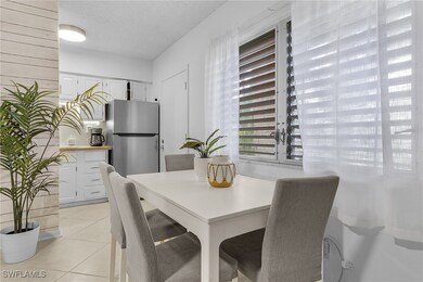 Tiled dining area with a textured ceiling