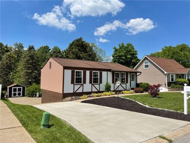 Newer concrete driveway leads to concrete sidewalk