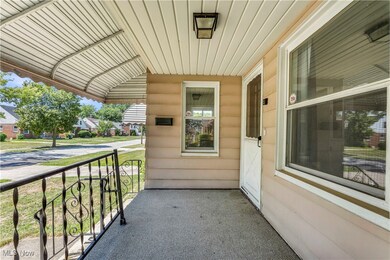 Covered porch with a residential view